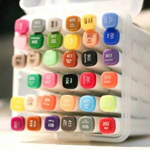 A set of colorful art markers in a clear case.