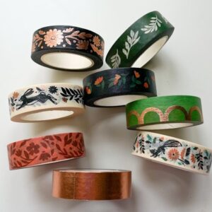 Decorative washi tapes with various patterns on a white background.
