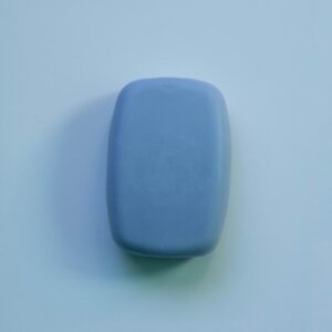 blue plastic container on white table